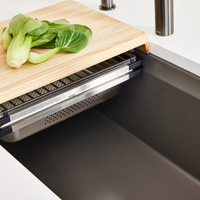 Close up view of Blanco Inteos kitchen workstation sink with wooden chopping board and colander