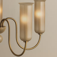 Close-up shot of modern Alessandra Chandelier with brass finish and beige glass shades