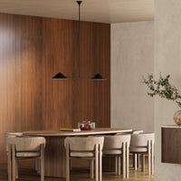 Alora Mood Ashford Linear Pendant in matte black finish over dining table