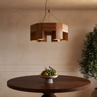 Kuzco 26" Bosco Chandelier in natural oak finish hanging over round wooden table