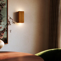 Kuzco Bosco 10" wall sconce in natural oak finish mounted on wall