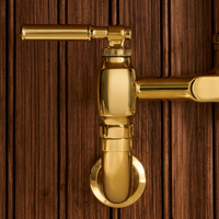 Close-up of Brizo Faircroft™ bridge faucet coin edge lever handle kit in luxe gold