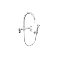 Brizo Faircroft wall-mount bridge faucet with arc spout and side spray in polished chrome