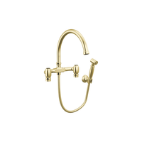 Brizo Faircroft wall-mount bridge faucet with arc spout and side spray in unlacquered brass