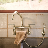 Brizo Faircroft wall-mount bridge faucet and side spray in polished nickel  finish with towel hanger accessory