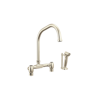 Brizo Faircroft deck-mount bridge faucet with angled spout and side spray in polished nickel