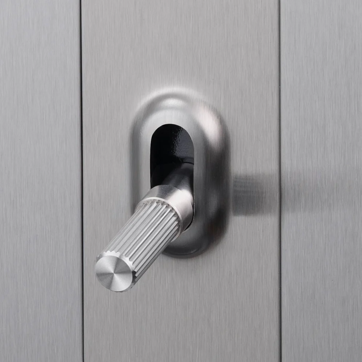Close up of Buster and Punch 1 Gang Toggle Linear light Switch in Steel