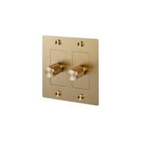 Buster and Punch 2 Gang Cross Dimmer Switch in Brass