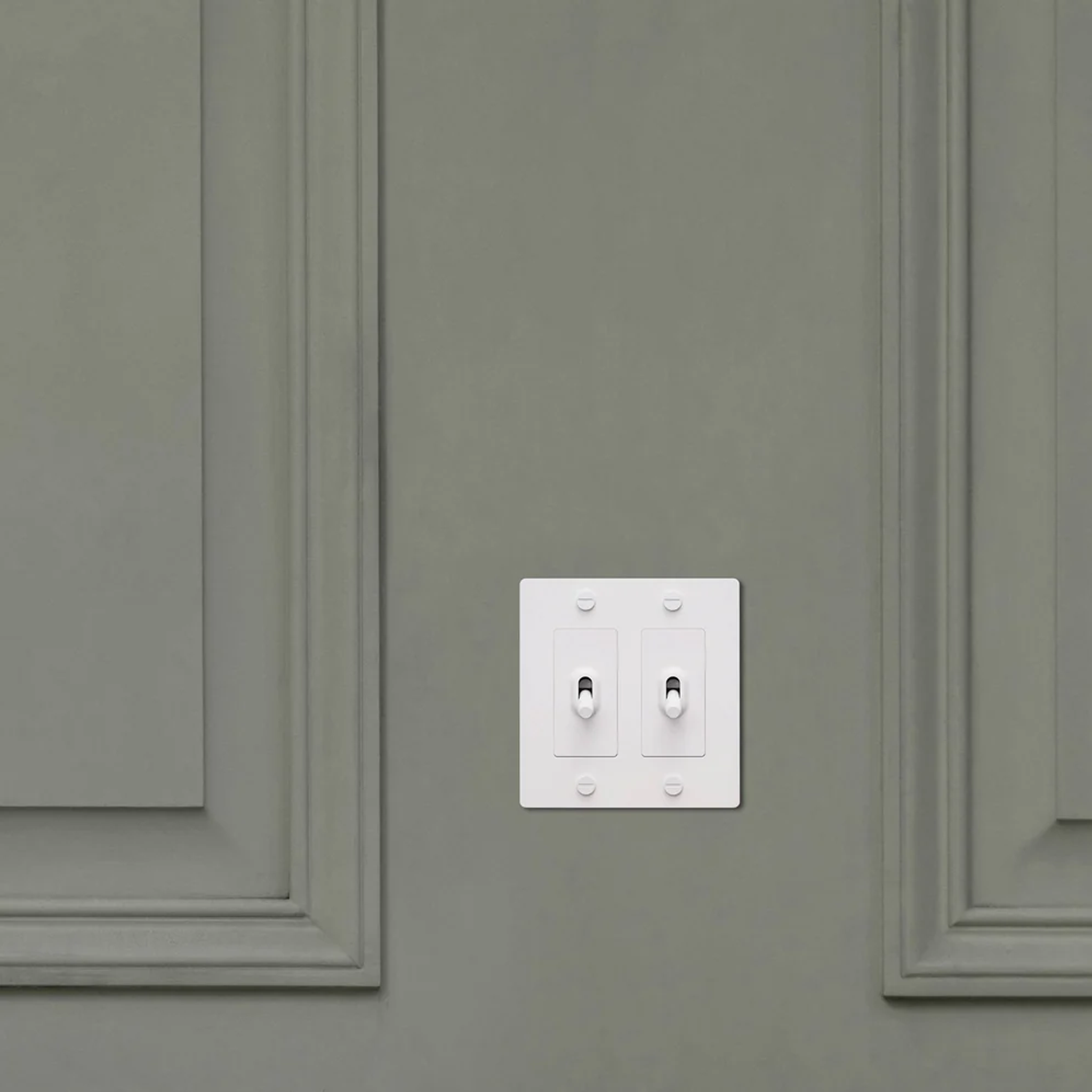 Buster & Punch White Light Switch 2 Gang Toggle with Cross design on Wall