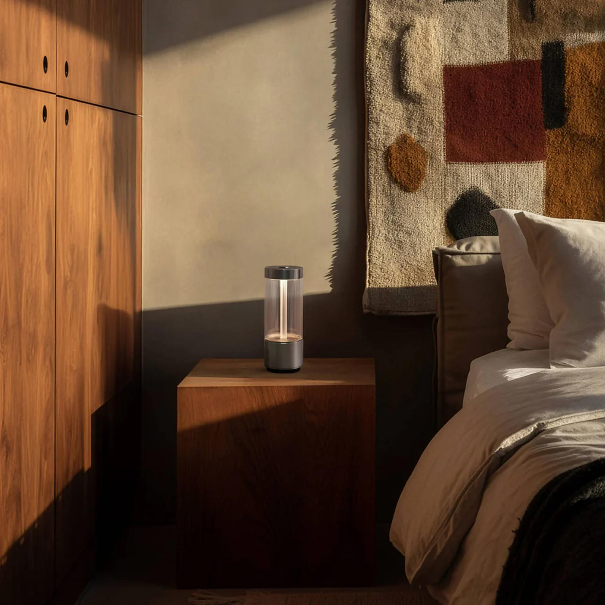 Bedroom with Buster and Punch Takeout Portable Light on nightstand.