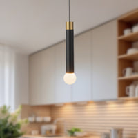Kuzco Calla Pendant Light in brushed gold and black vegan leather finish hanging in modern kitchen