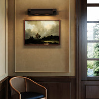 Alora Darby Wall Picture Light in urban bronze finish above framed painting