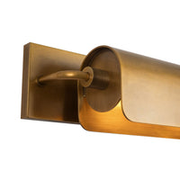 Close-up view of Alora Darby wall picture light in vintage brass finish