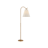 Eula floor lamp by Hudson Valley with a Patina Brass metal stand and curved arm, holding a white pleated shade.