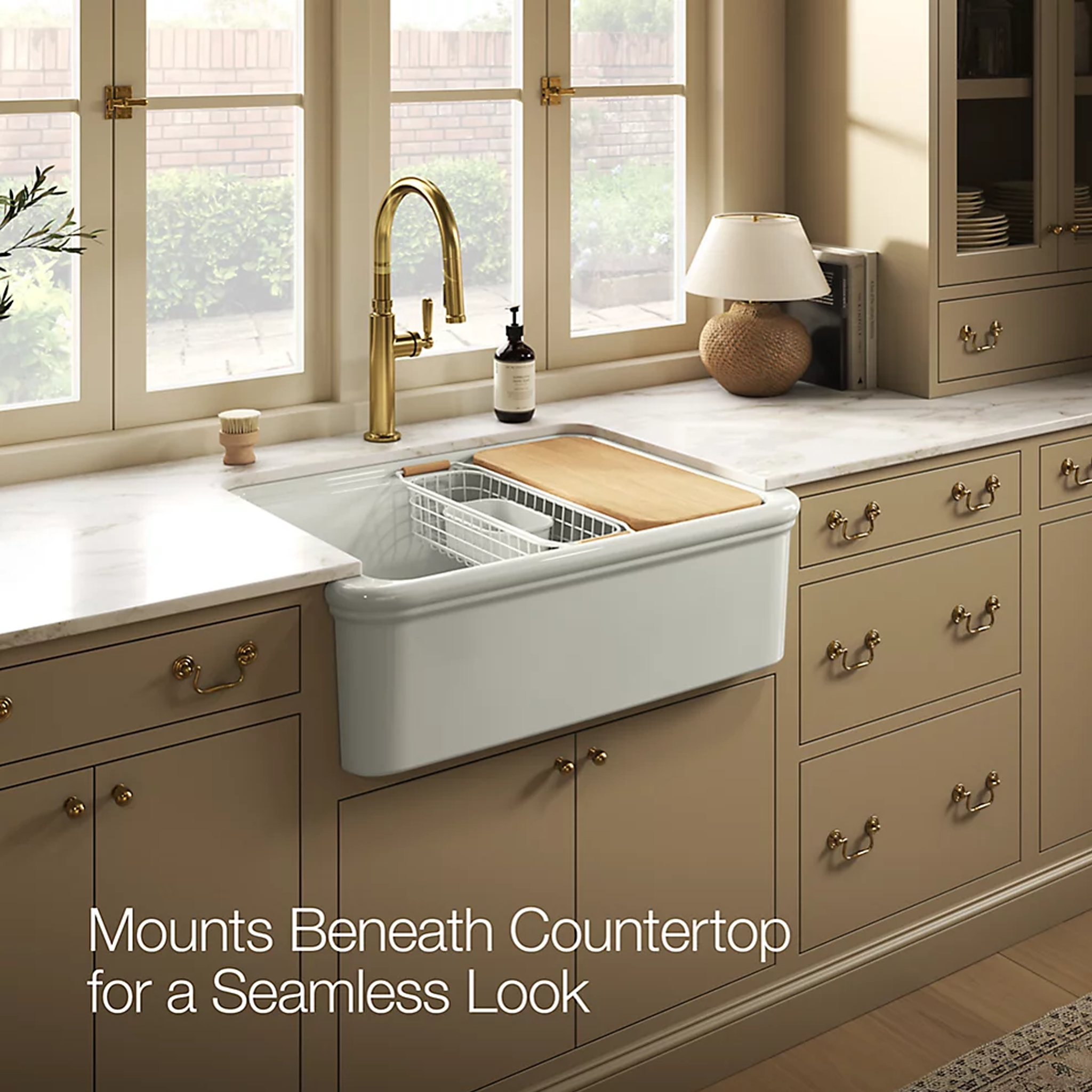 AUDRINE™ undermount single-bowl farmhouse kitchen sink by Kohler in beige kitchen