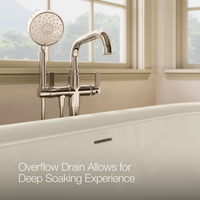Close-up of Kohler CLAUDE™ freestanding bathtub faucet and overflow drain.