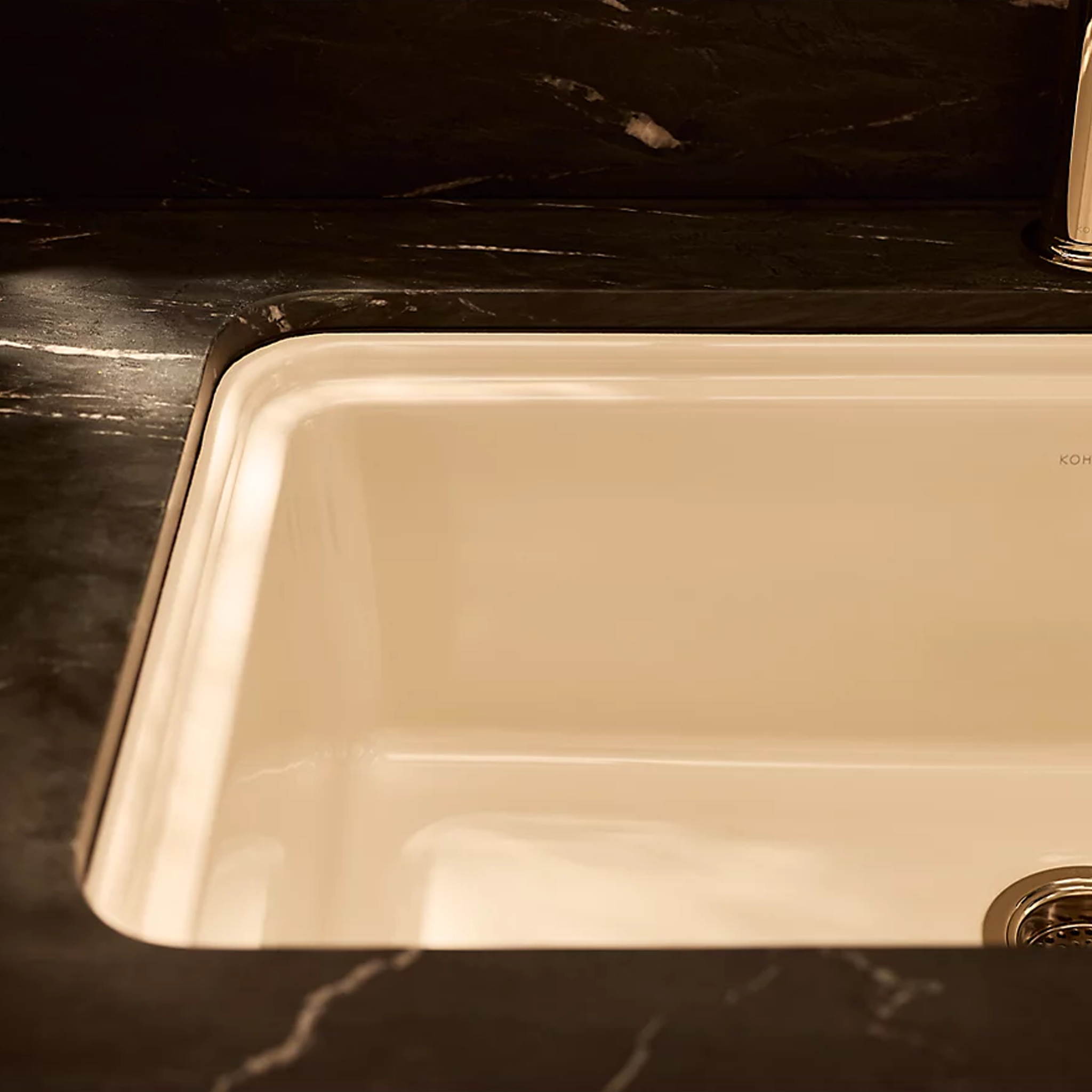 Audrine™ undermount single-bowl kitchen sink by Kohler in cream