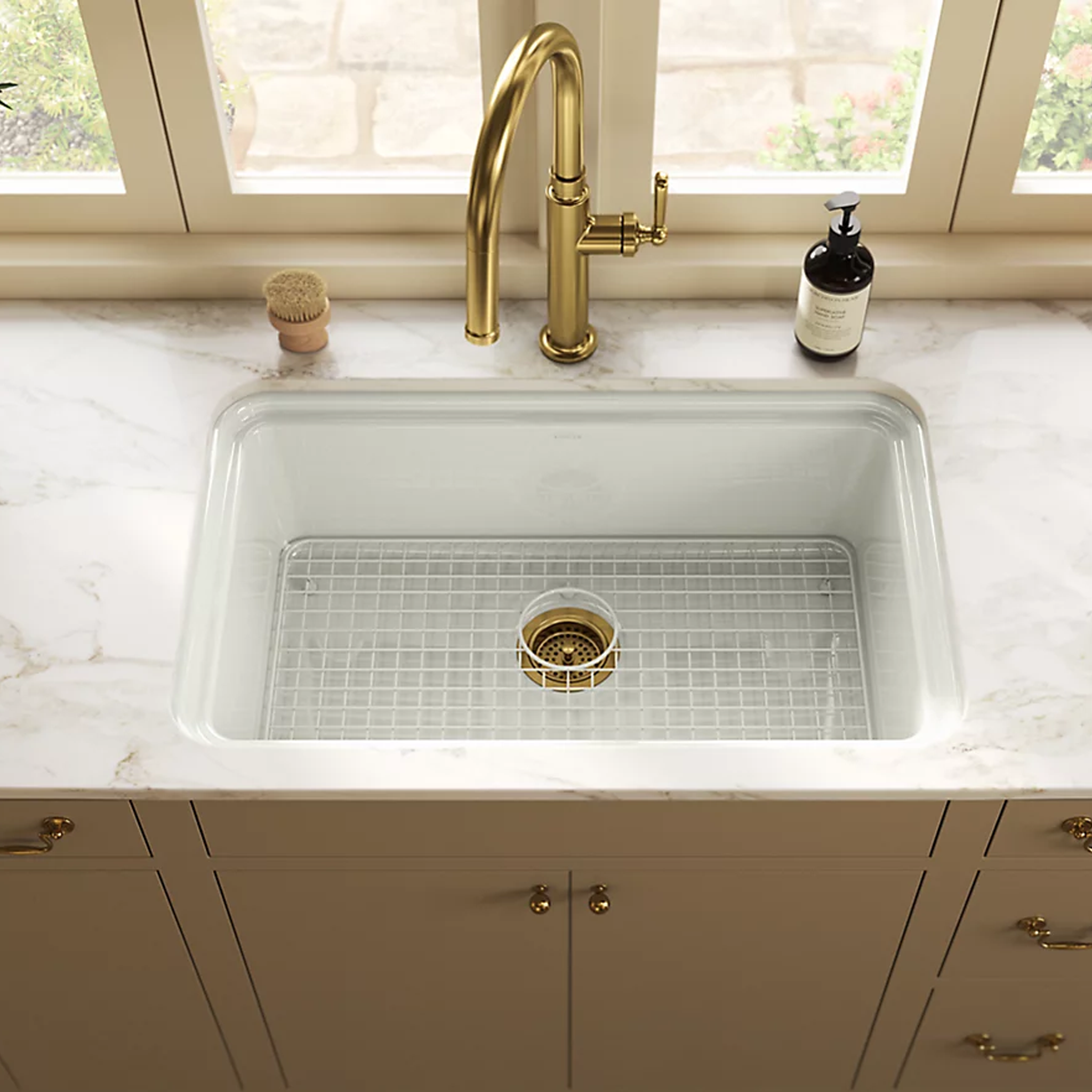AUDRINE™ undermount single-bowl kitchen sink by Kohler with gold faucet