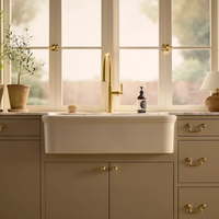 Audrine™ undermount single-bowl farmhouse kitchen sink by Kohler in beige kitchen setting