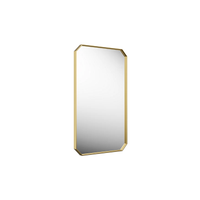 Claude™ rectangular framed mirror in brass by Kohler