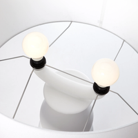Close-up of a modern Farooo floor light fixture with two light bulbs