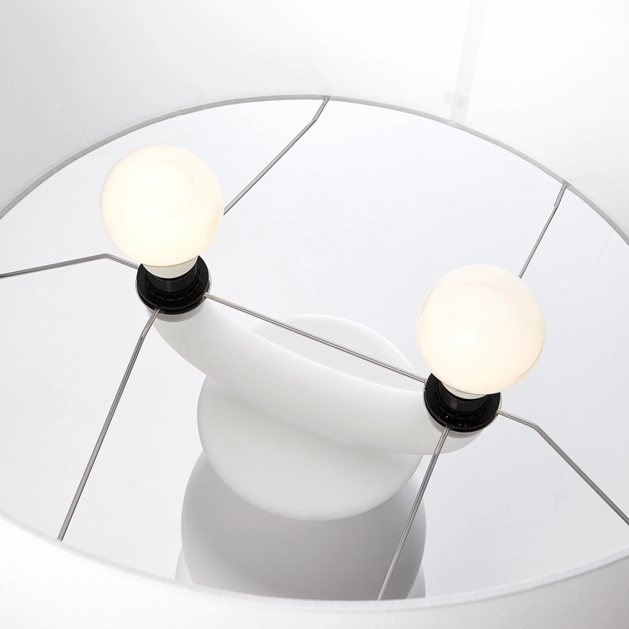 Close-up of a modern Farooo floor light fixture with two light bulbs
