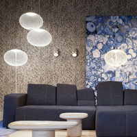 Modern living room with decorative wall art, and white NR2 floor lamp.