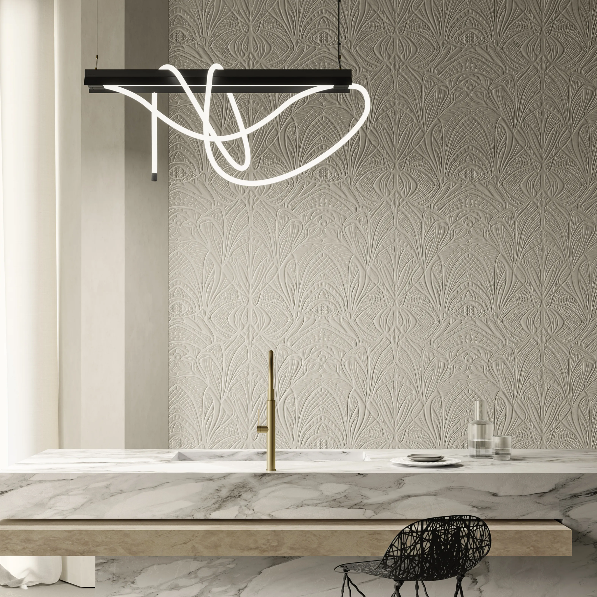 Modern kitchen with marble countertop, patterned wallpaper, and Tubelight pendant light.