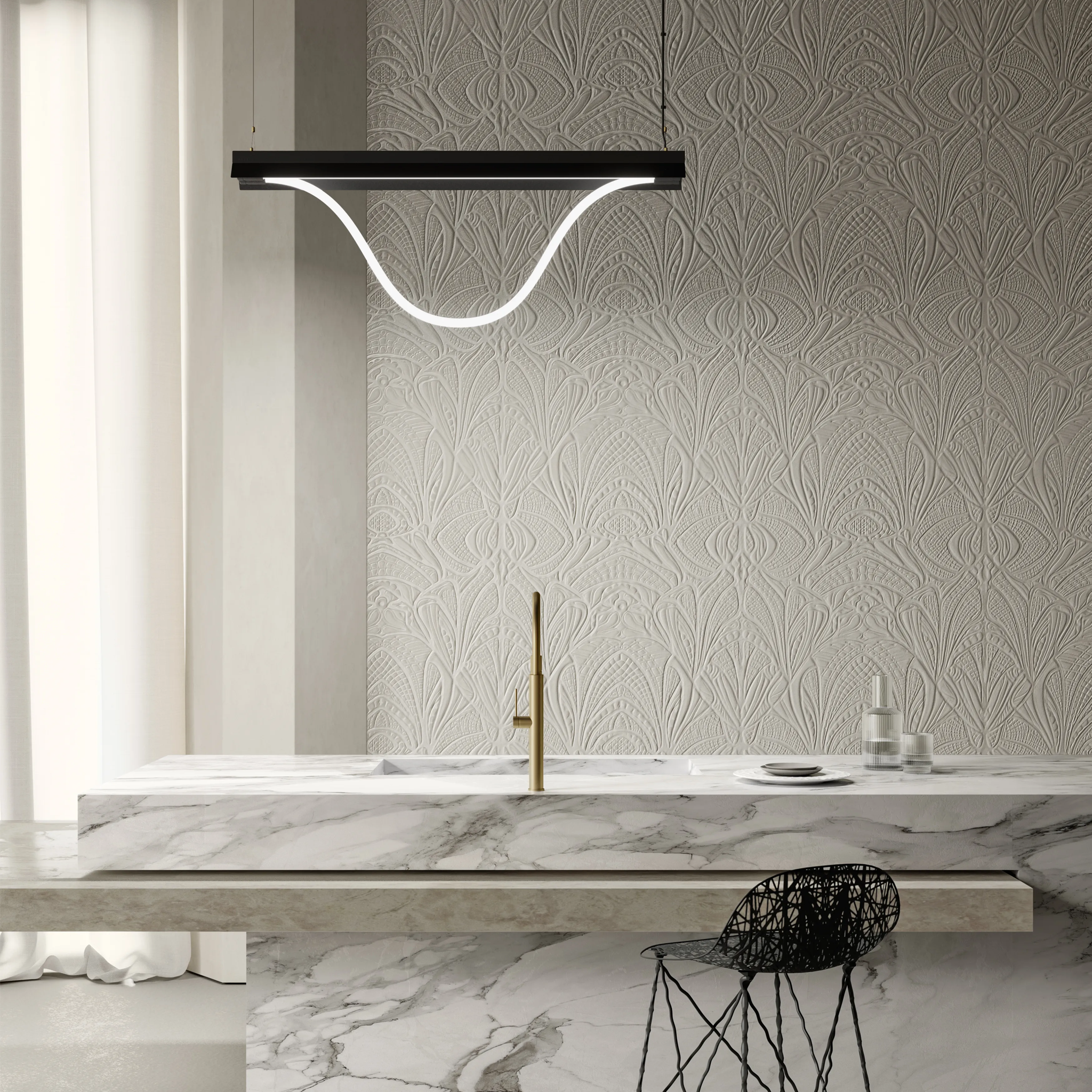 Modern kitchen with marble countertop, gold faucet, and Tubelight pendant light.
