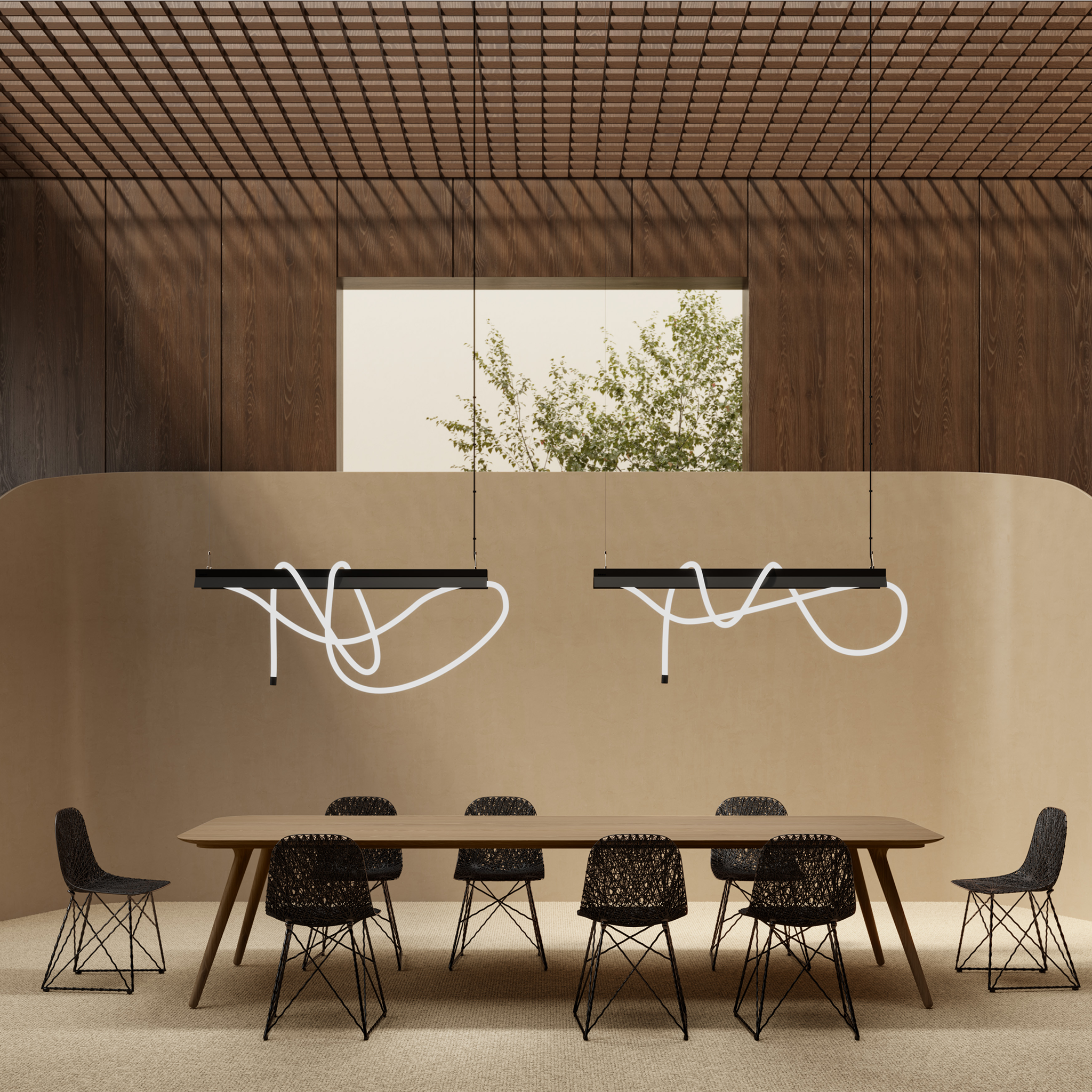 Modern dining area with a long wooden table and black chairs under two Moooi Tubelight suspension lights.