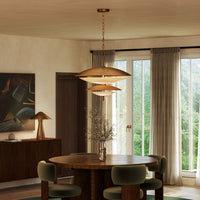Alora Prescott Chandelier in vintage brass finish over dining table