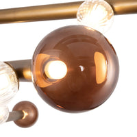 Details of Kuzco Reese Chandelier with vintage brass finish and amber glass