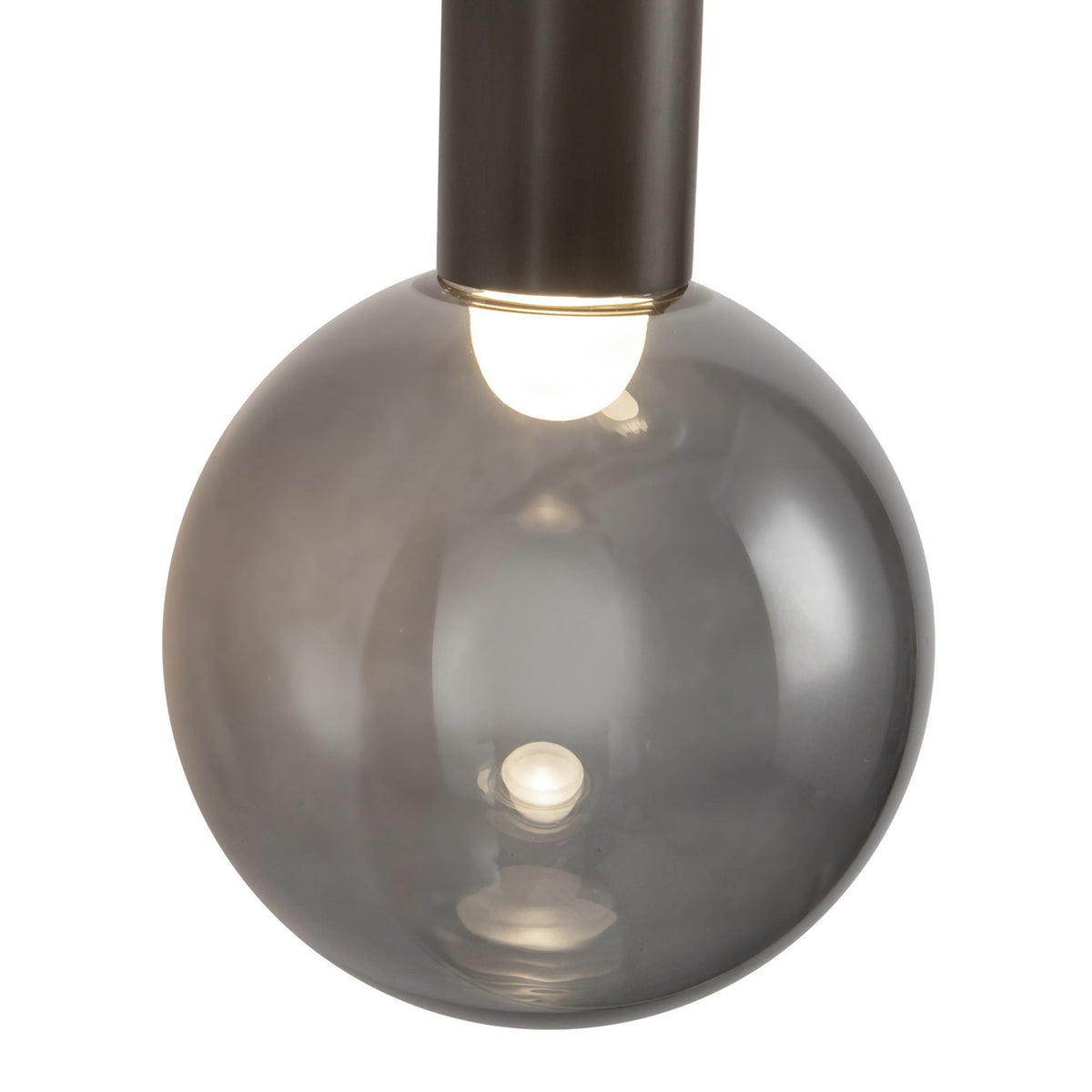 Close-up view of Kuzco Reese Wall Sconce in urban bronze finish with smoke glass