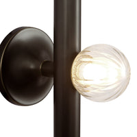 Close-up view Kuzco Reese Wall Sconce in urban bronze finish with amber glass