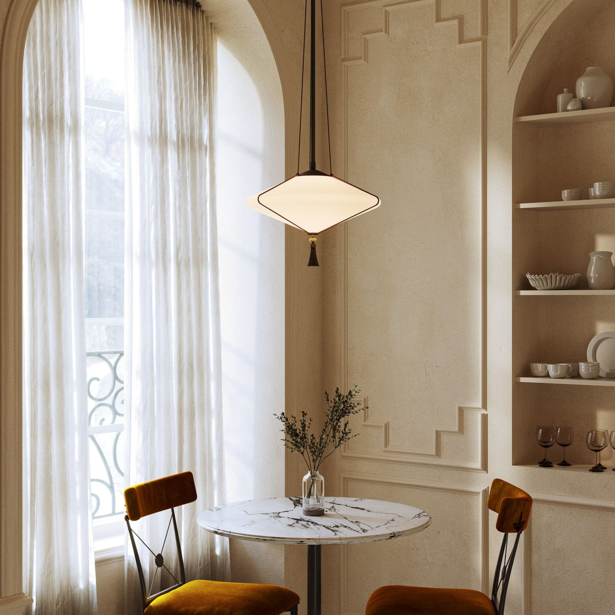 Alora Reeve pendant light in matte black with opal glass above a table