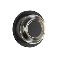 Angled view of Kuzco Stephord exterior wall sconce with black finish and clear glass