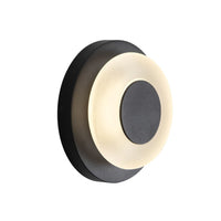 Angled view of Kuzco Stephord exterior wall sconce in black with frosted glass