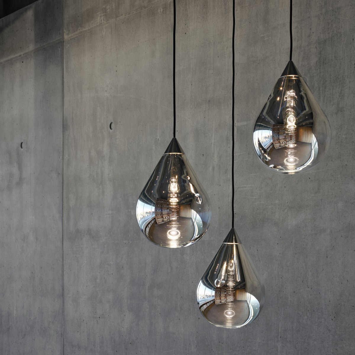 Tom Dixon Flare Pendant lights in silver finish with reflective glass teardrop design