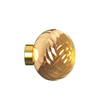 Tom Dixon Whirl LED wall light in gold finish