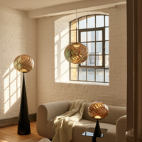 Tom Dixon Whirl LED Pendant lamp, table lamp and standing lamp in gold glass finish in living room