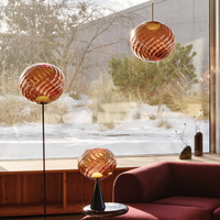 Tom Dixon Whirl LED Pendant lamp, table lamp and standing lamp in copper in modern room