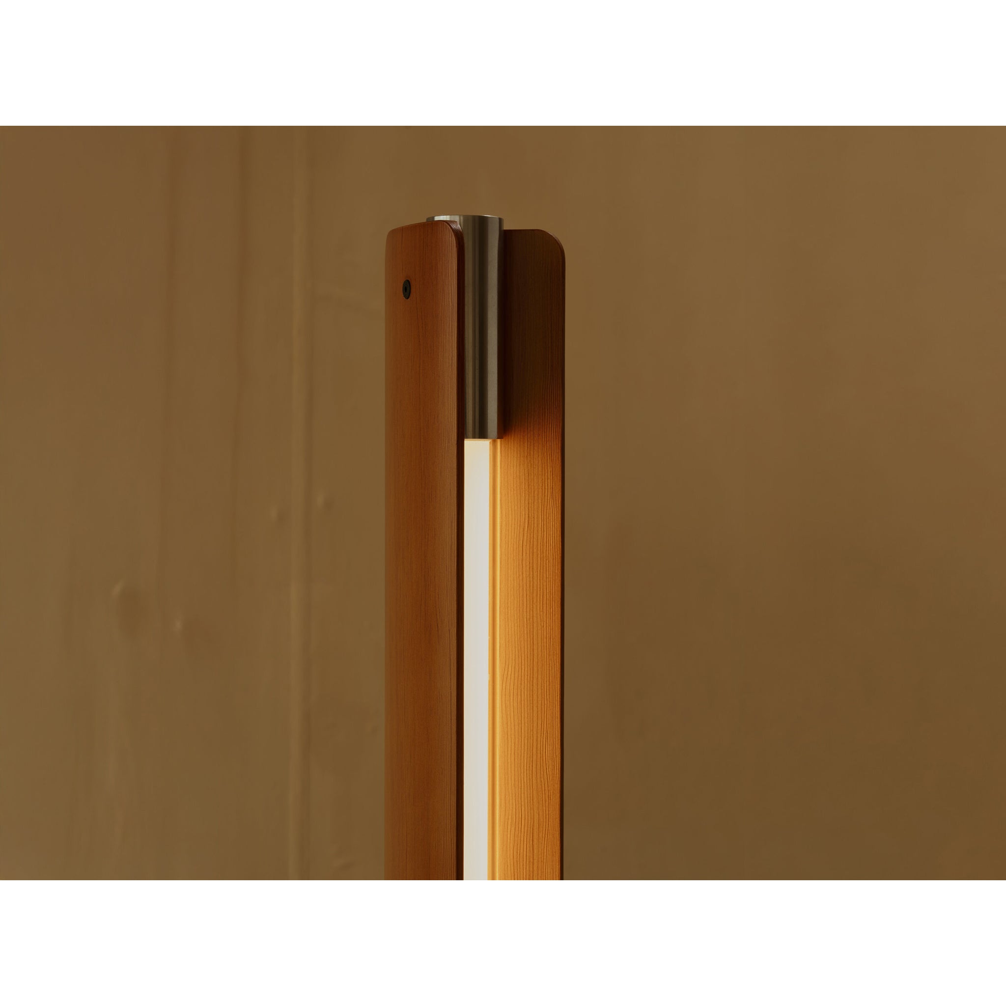 Close-up detail of Flos Seki-Han floor lamp, featuring a warm wood frame, integrated illuminated diffuser, and brushed metal accent at the top.