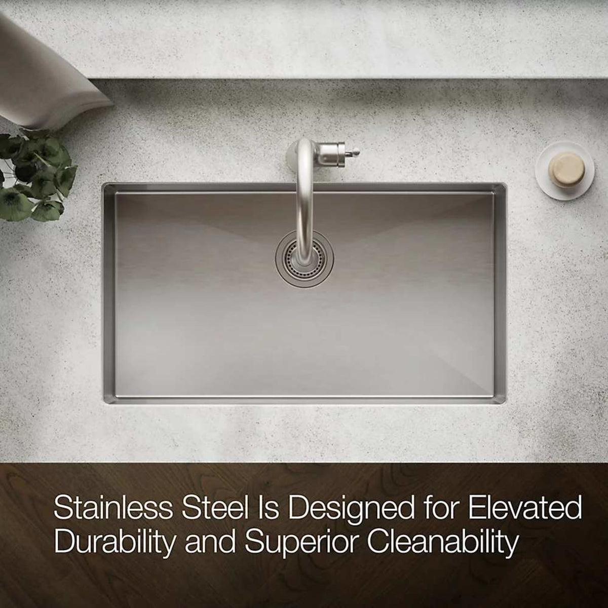 Stainless steel kitchen sink with faucet on countertop